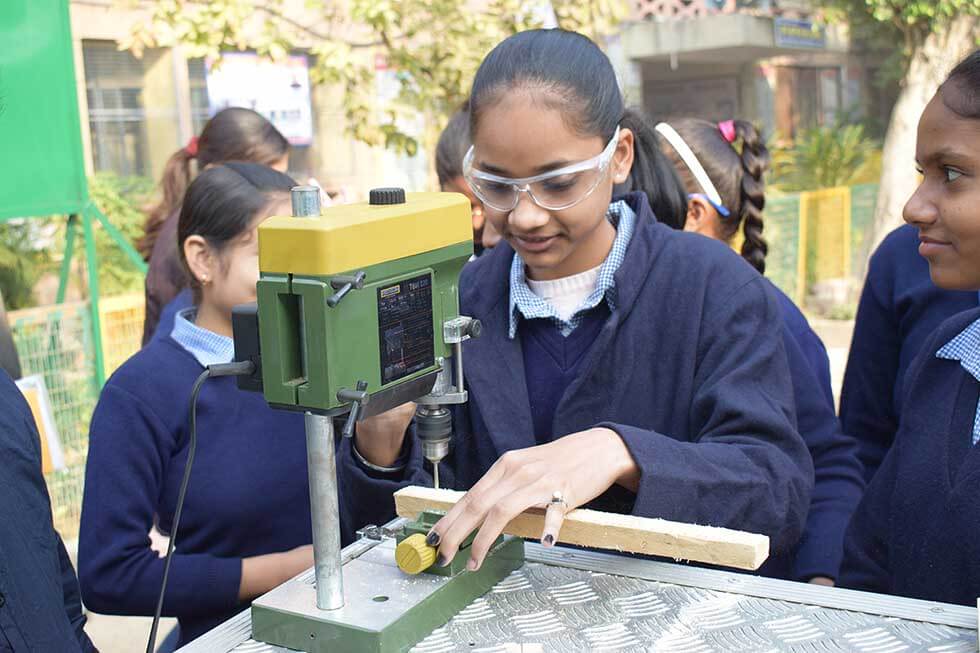 Girls taking a vocational class at a school in India. Credit: Lend A Hand India.